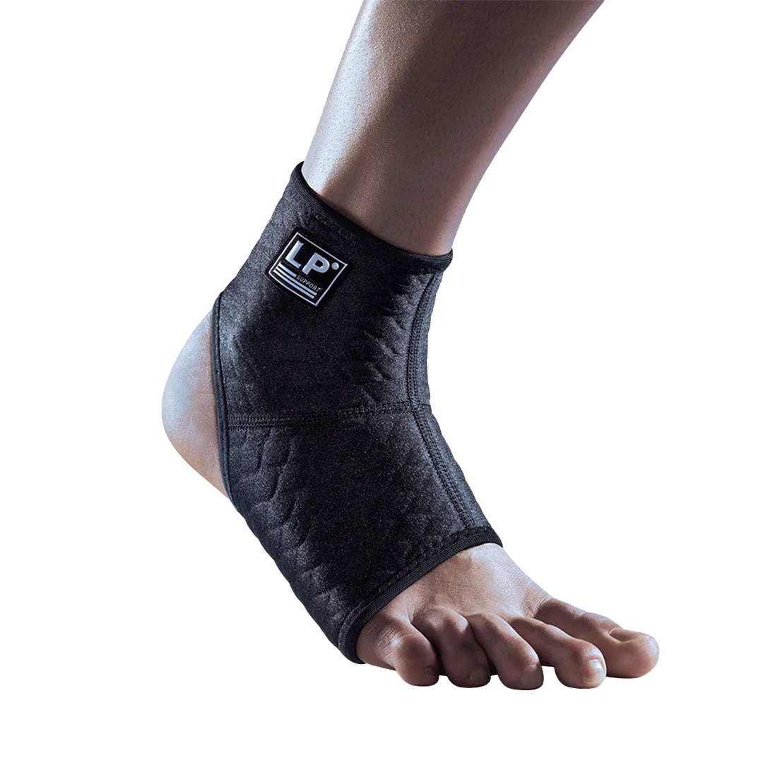 Black ankle support brace on a foot with a white background