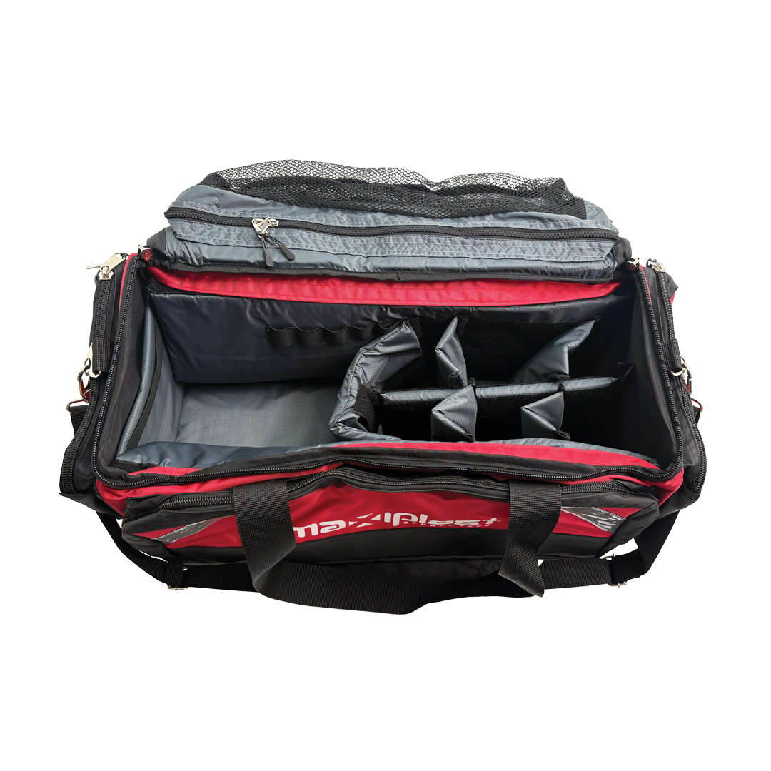 Open red and black duffel bag with compartments on a white background